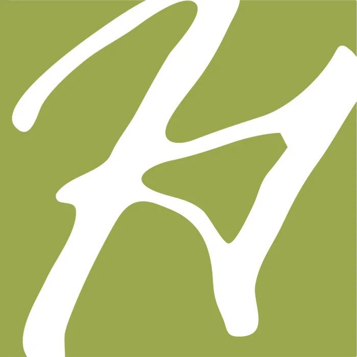 White abstract "H" shape on green background, symbolizing a home builder logo.